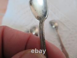 4 antique solid silver salt spoons by jeweler L & R and 2 crossed oars