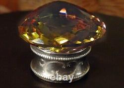 Alexandrite, 121 carats, maximum color change, on an antique solid silver base.