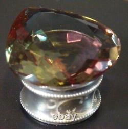 Alexandrite, 121 carats, maximum color change, on an antique solid silver base.