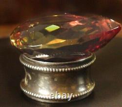 Alexandrite, 121 carats, maximum color change, on an antique solid silver base.