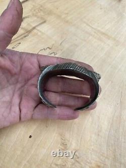 Ancient jewelry: solid silver bracelet with a cross from Eastern Russia