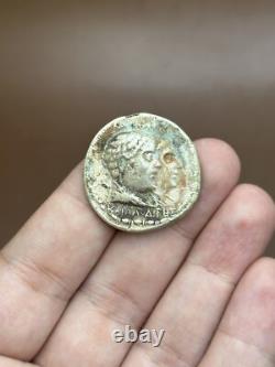 Ancient solid silver tetradrachm coin of the Greco-Bactrian king