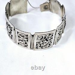 Antique Solid Silver Bracelet from Indochina Early 20th Century with Pagoda and Dragon Decorations