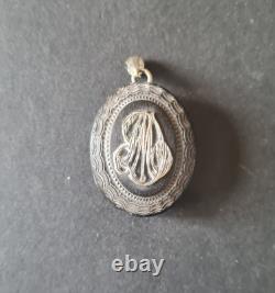 Antique ebonite keepsake pendant with solid silver monogram, 19th century