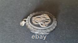 Antique ebonite keepsake pendant with solid silver monogram, 19th century