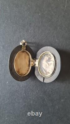 Antique ebonite keepsake pendant with solid silver monogram, 19th century