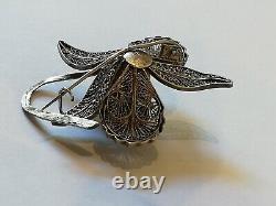 Antique filigree solid silver flower brooch