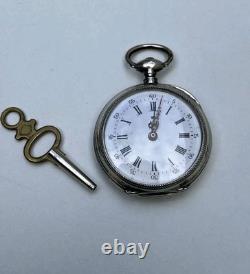Antique silver pocket watch with key, enamel dial, Roman numerals