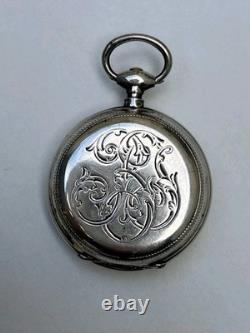 Antique silver pocket watch with key, enamel dial, Roman numerals