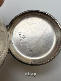 Antique silver pocket watch with key, enamel dial, Roman numerals