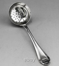 Antique silver sugar spoon or tea strainer, sterling silver, 1st standard hallmark