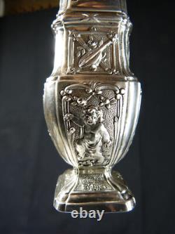 Antique solid silver baluster sugar shaker on pedestal with cherub decoration