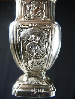 Antique solid silver baluster sugar shaker on pedestal with cherub decoration
