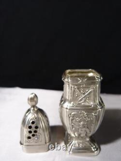 Antique solid silver baluster sugar shaker on pedestal with cherub decoration