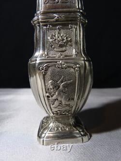 Antique solid silver baluster sugar shaker on pedestal with cherub decoration