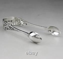 Antique solid silver sugar tongs with English London hallmarks 1894