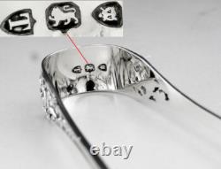 Antique solid silver sugar tongs with English London hallmarks 1894