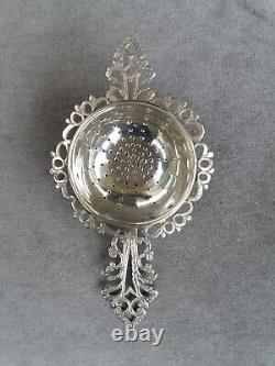 Antique solid silver tea strainer