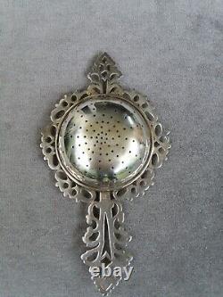 Antique solid silver tea strainer