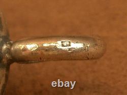 Beautiful ancient silver bell with a decoration of seagulls and swallows.