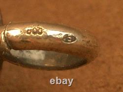 Beautiful ancient silver bell with a decoration of seagulls and swallows.