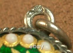 Beautiful old pendant in solid silver and Bressan enamels with a green background