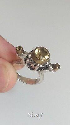 Impressive antique solid silver ring with 2 ct round faceted citrines.