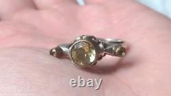 Impressive antique solid silver ring with 2 ct round faceted citrines.
