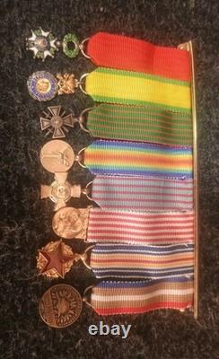 Old 8-medal reduction bar with 2 solid silver medals