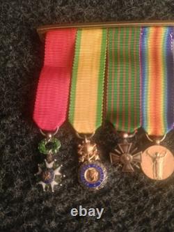 Old 8-medal reduction bar with 2 solid silver medals