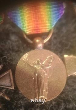 Old 8-medal reduction bar with 2 solid silver medals