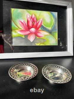 Old pair of solid silver dishes with reticulated border, diameter 7.9 cm