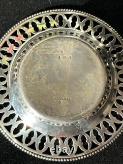 Old pair of solid silver dishes with reticulated border, diameter 7.9 cm