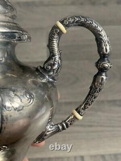 Old selfish solid silver teapot from the 19th century