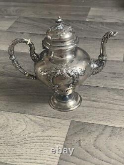 Old selfish solid silver teapot from the 19th century