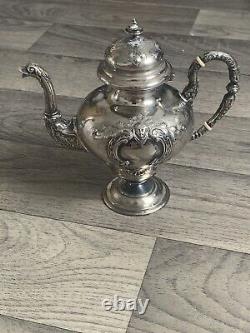 Old selfish solid silver teapot from the 19th century