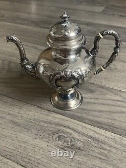 Old selfish solid silver teapot from the 19th century