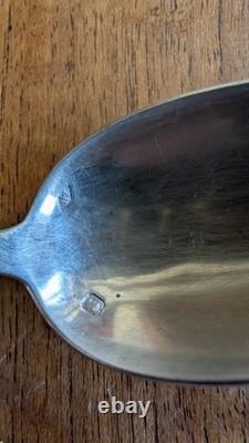 Pair of antique solid silver spoons, Minerva hallmark and silversmith’s mark