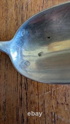 Pair of antique solid silver spoons, Minerva hallmark and silversmith’s mark