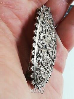 Translate this title in English: Ancient solid silver brooch to identify.