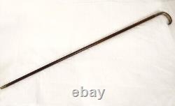 Translation: Antique cane with solid silver handle, floral design, wooden shaft, 19th century.