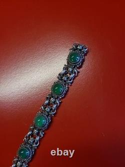 Very beautiful antique articulated bracelet in solid silver and green cabochons