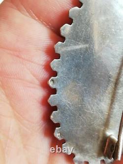 Ancienne broche en argent massif à identifier