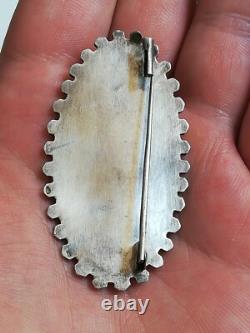 Ancienne broche en argent massif à identifier