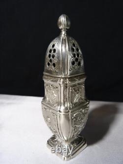 Saupoudreuse en argent massif balustre ancienne sur piédouche à décor ange putti