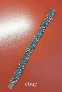 Très beau ancien bracelet articulé en argent massif et cabochons vert sanglier