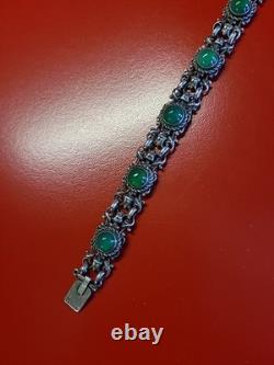 Très beau ancien bracelet articulé en argent massif et cabochons vert sanglier