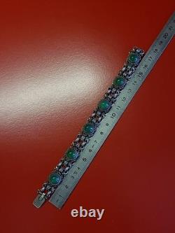 Très beau ancien bracelet articulé en argent massif et cabochons vert sanglier